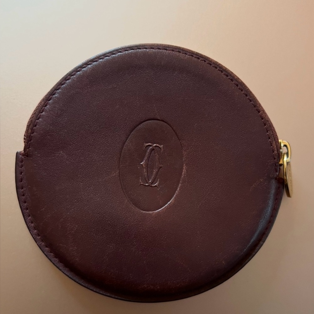 Vintage Cartier round zippered coin purse in burgundy